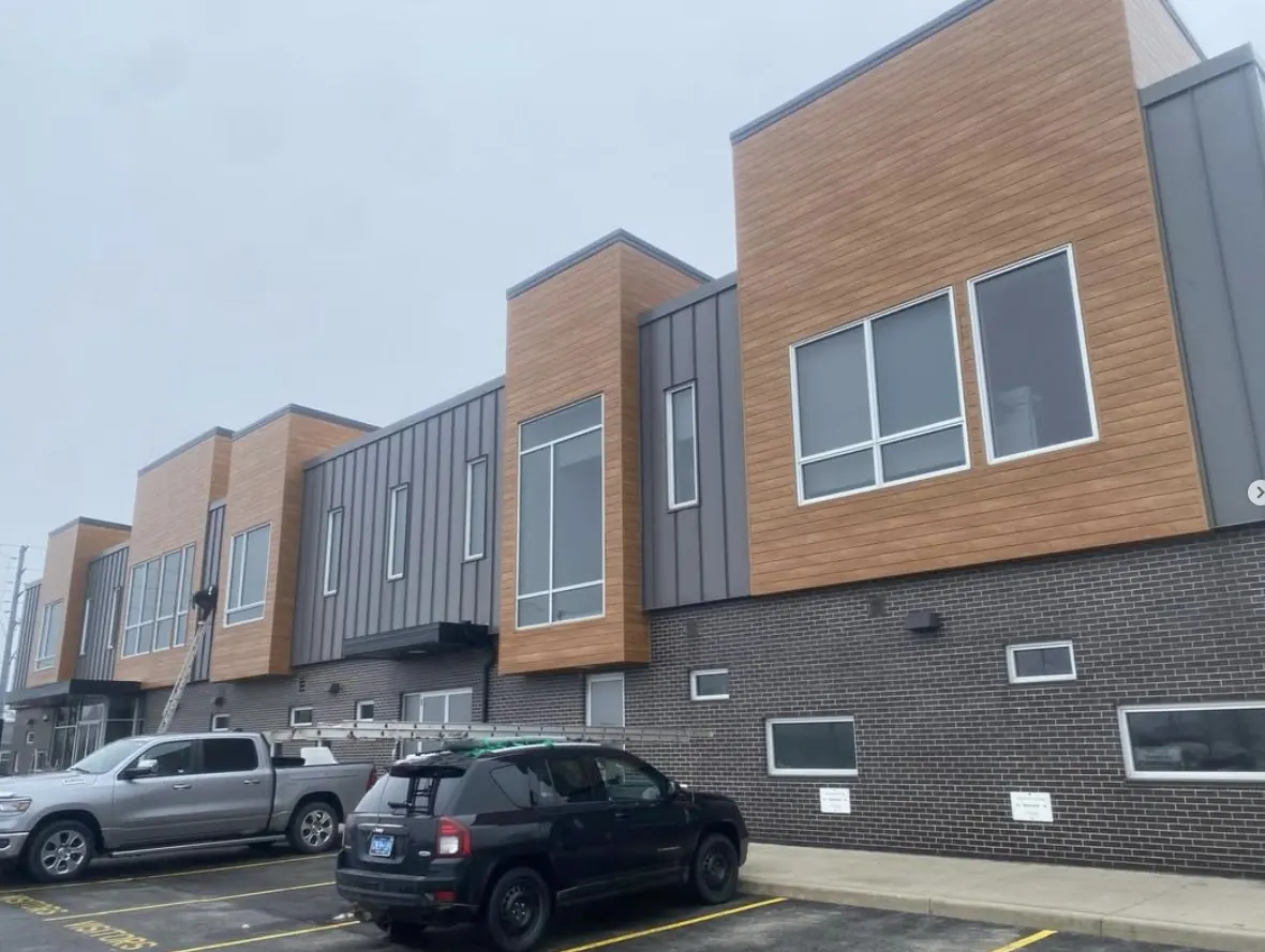 Commercial window cleaning on modern multi-storey building exterior in Guelph Ontario