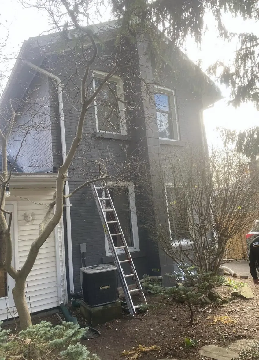 Residential home exterior window cleaning with Doering Window Cleaning vehicle in Guelph